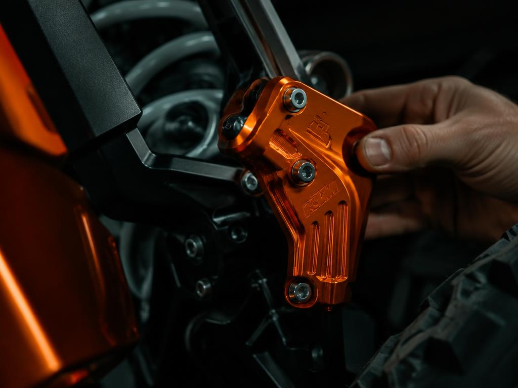 Precision machined part being fitted to a bike